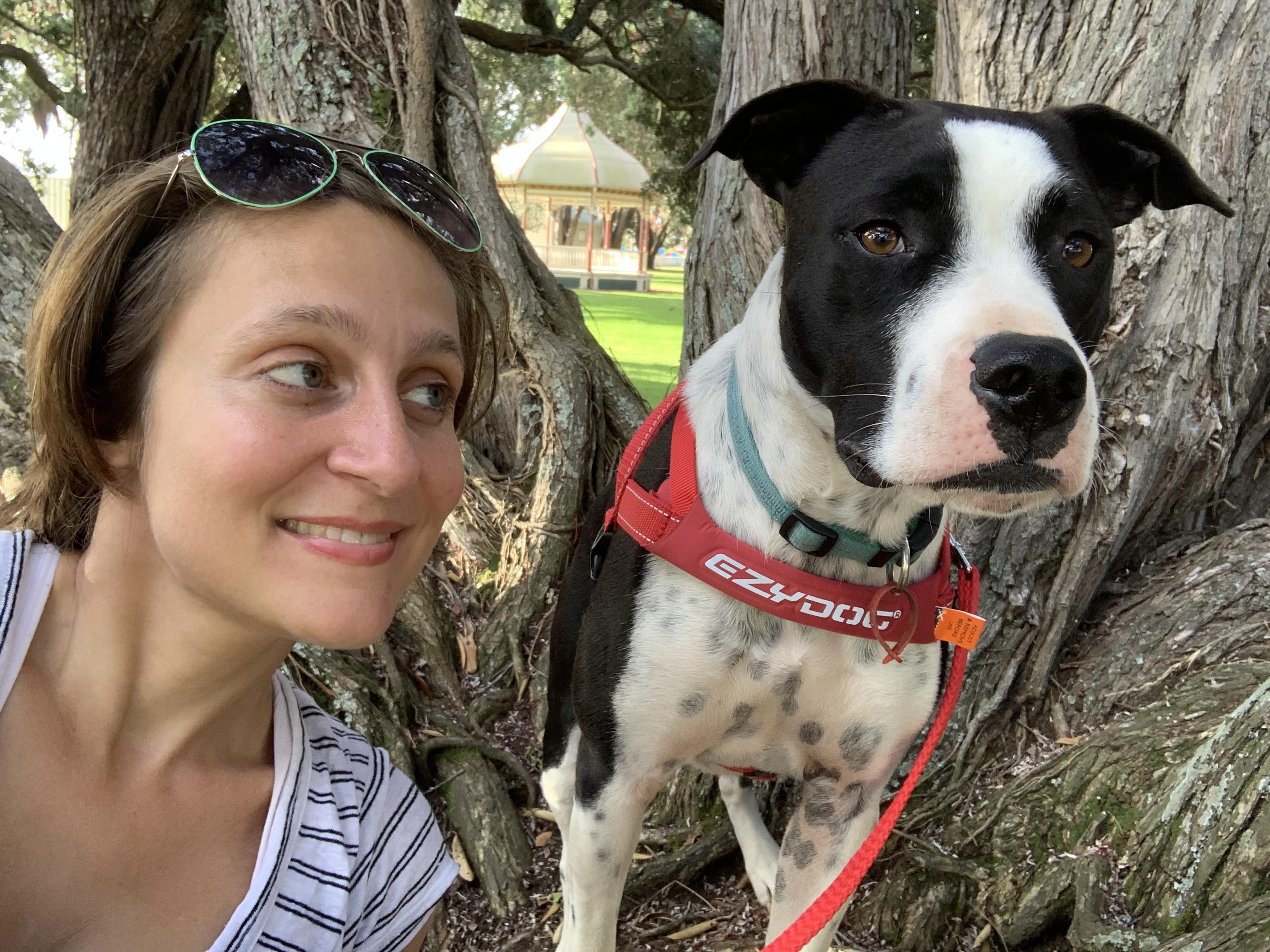 Ompractice teacher Anjali Sunita with puppy Prince in a tree