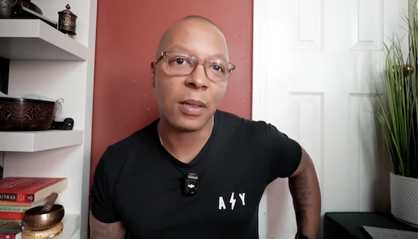 Ompractice teacher Dominic Stanley sitting in a room