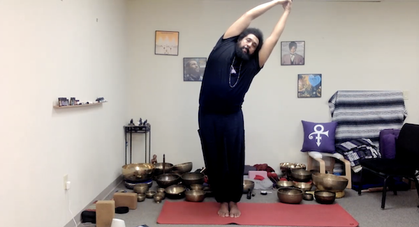 Reggie Hubbard demonstrating a standing pose on a mat