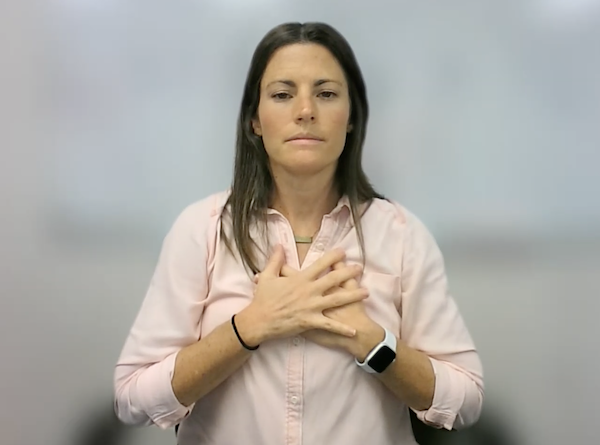 Ompractice teacher Sarah Plummer Taylor head shot in blue shirt with white background