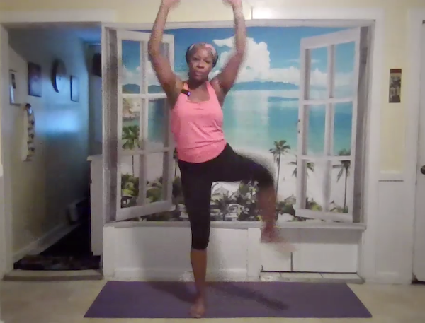 Ompractice teacher Charisse Burrus in lateral lunge