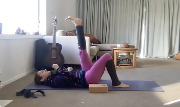 Ompractice teacher Anjali Sunita head shot with black tank top