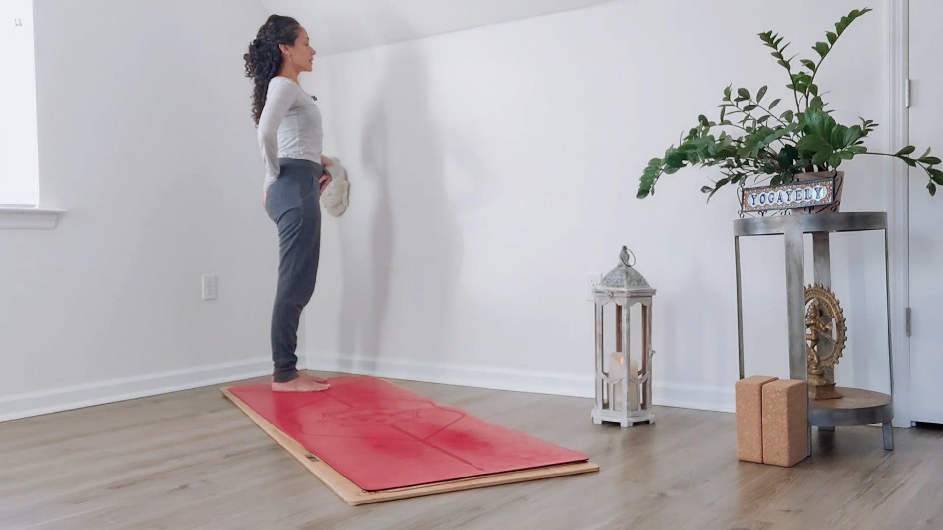 Ompractice teacher Yely Rivas demonstrating the mountain pose standing from the side