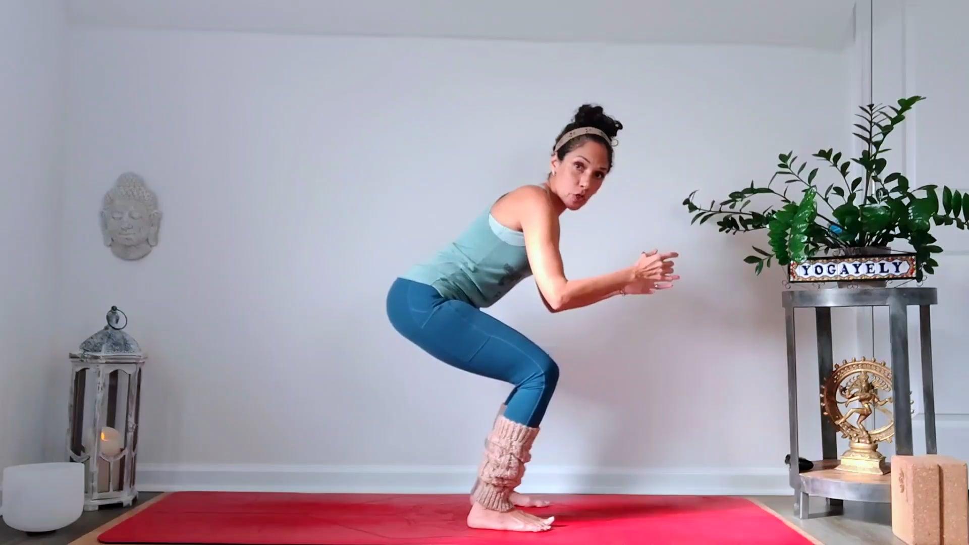 Ompractice teacher Yely demonstrating a chair pose in a modified squat