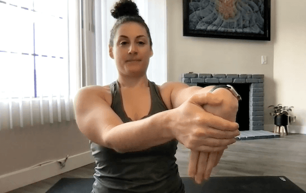 Niki Saccareccia doing a seated bend of hand