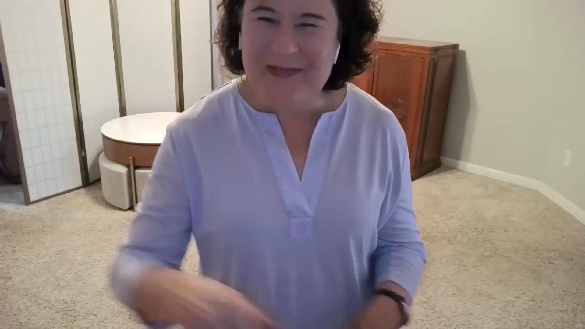 Ompractice teacher Patricia Lawson teaching seated tai chi