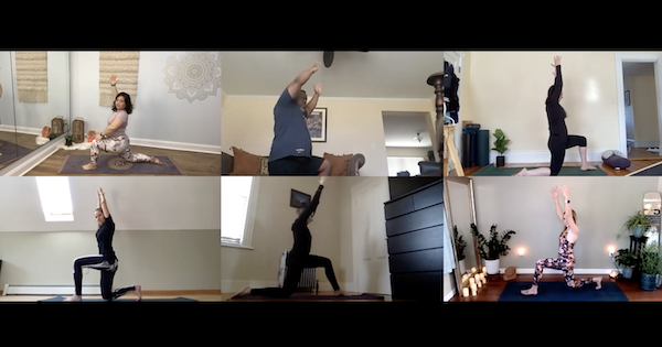 Traci Ayers, with her hands in a prayer position in front of trees