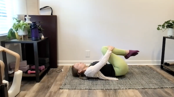 Ompractice teacher Brianna Rhea left profile headshot with black background