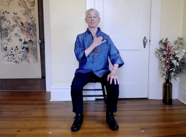 Ompractice teacher Gurney Bolster seated