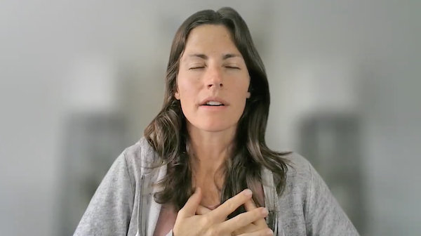 Ompratice teacher Sarah Plummer Taylor seated guiding meditation