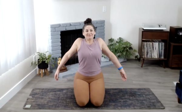 Ompractice teacher Niki Saccareccia demonstrating a shoulder roll