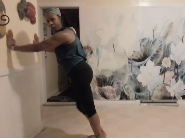 Ompractice teacher Charisse demonstrates a wall pushup