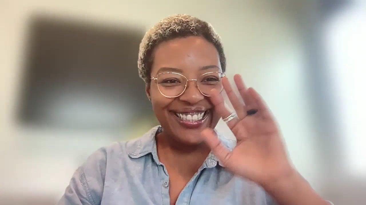 Ompractice teacher Jess Haynes waving at camera
