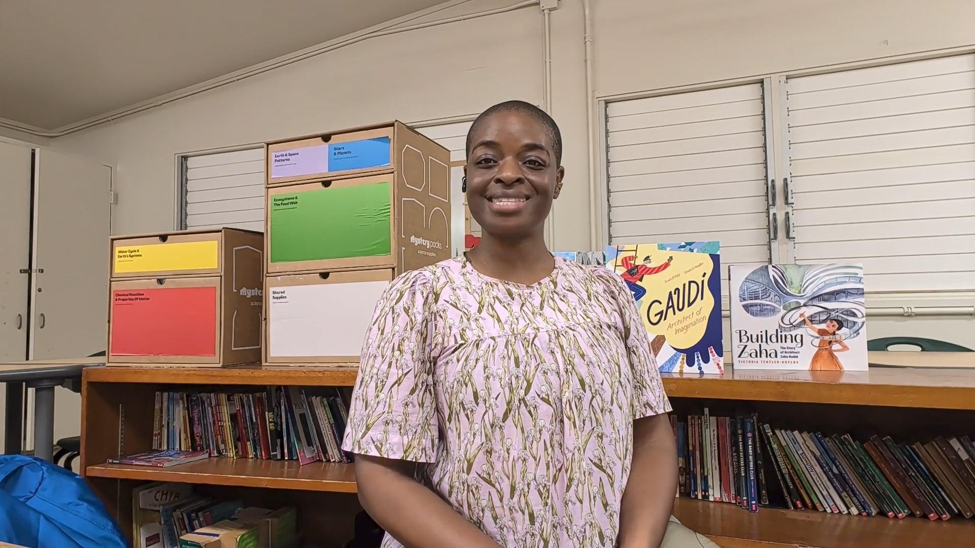 Ompractice teacher Alynthia Penn sitting in her classroom