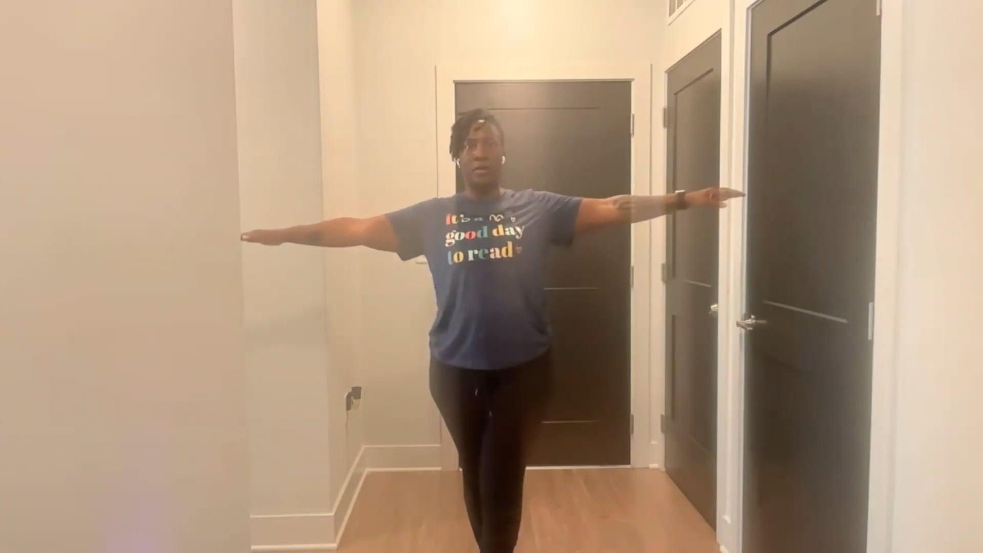 Ompractice teacher Tasha Edwards standing with arms wide