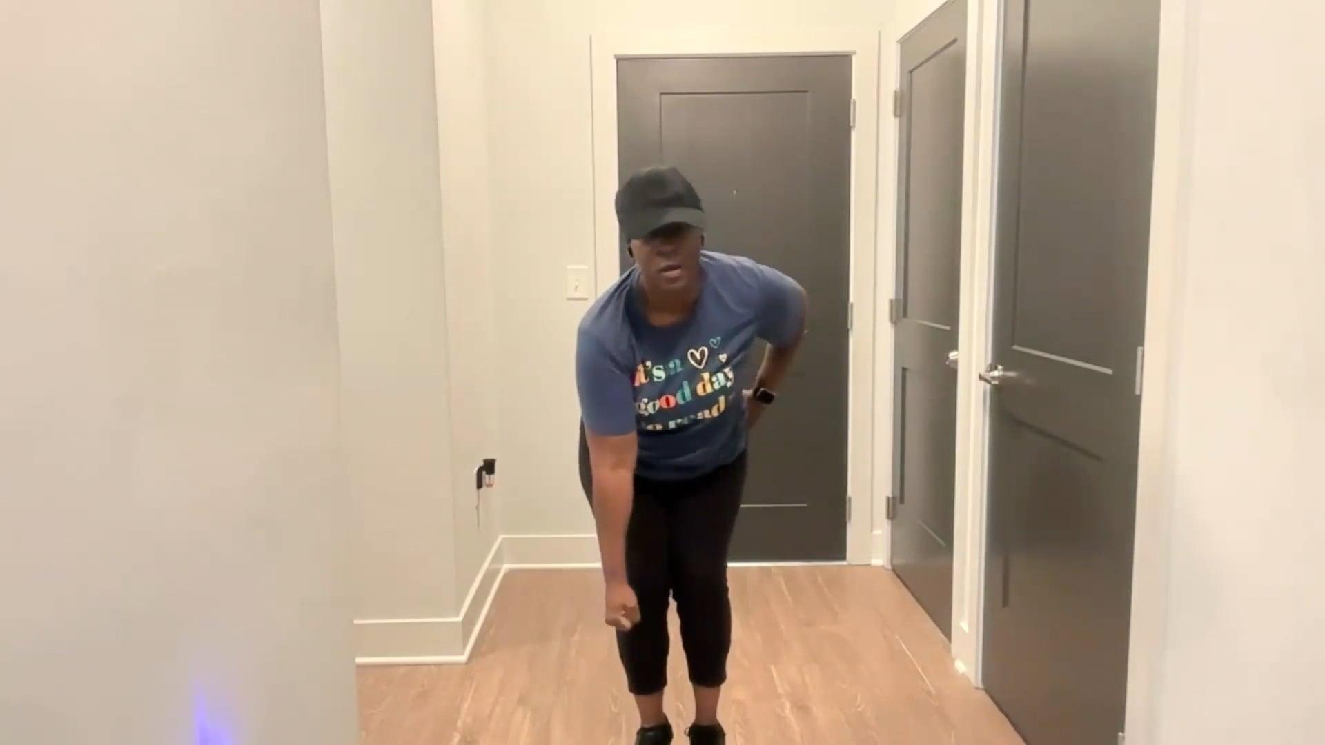 Ompractice teacher Tasha Edwards bending forward