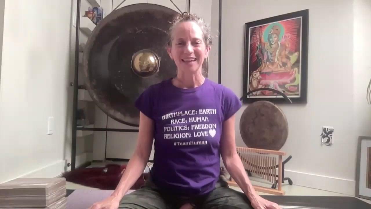 Ompractice teacher Emily Wiadro sitting on mat
