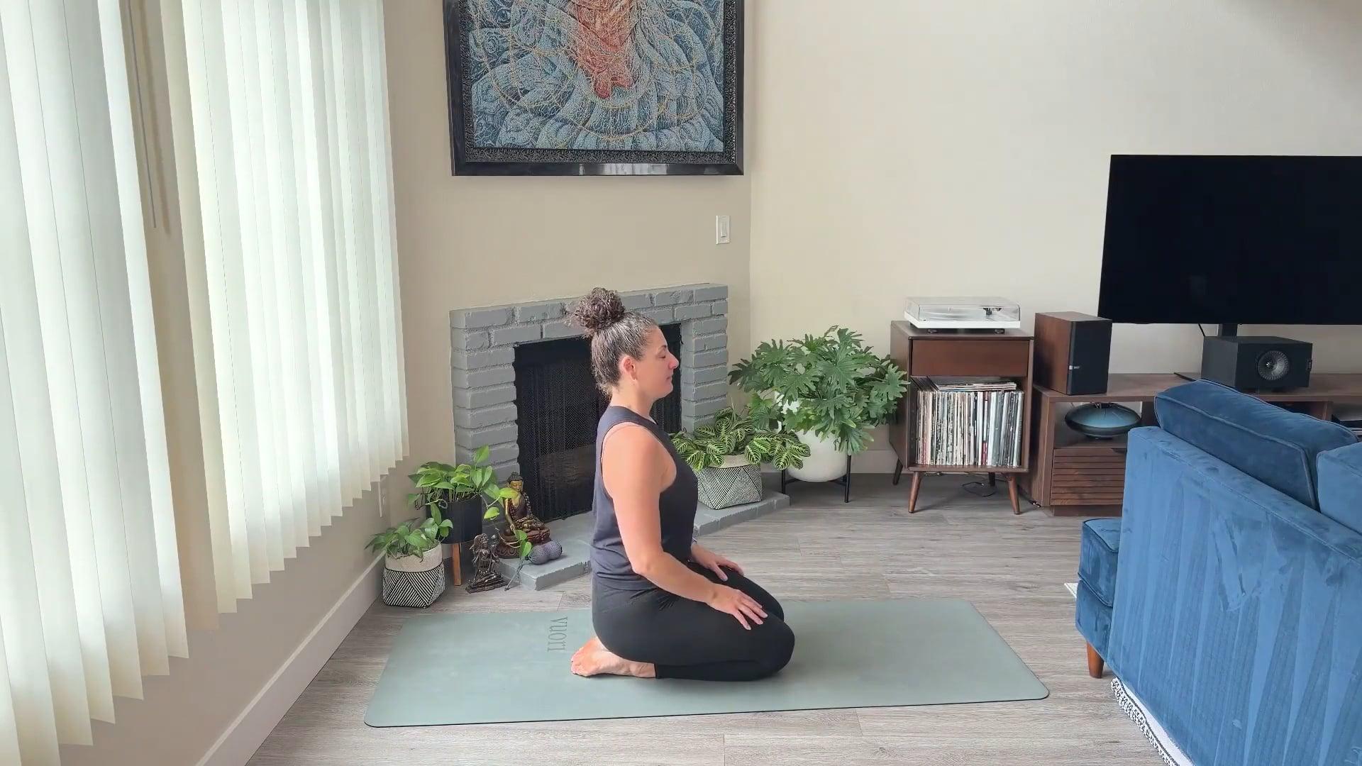 Ompractice teacher Niki Saccareccia sitting on floor