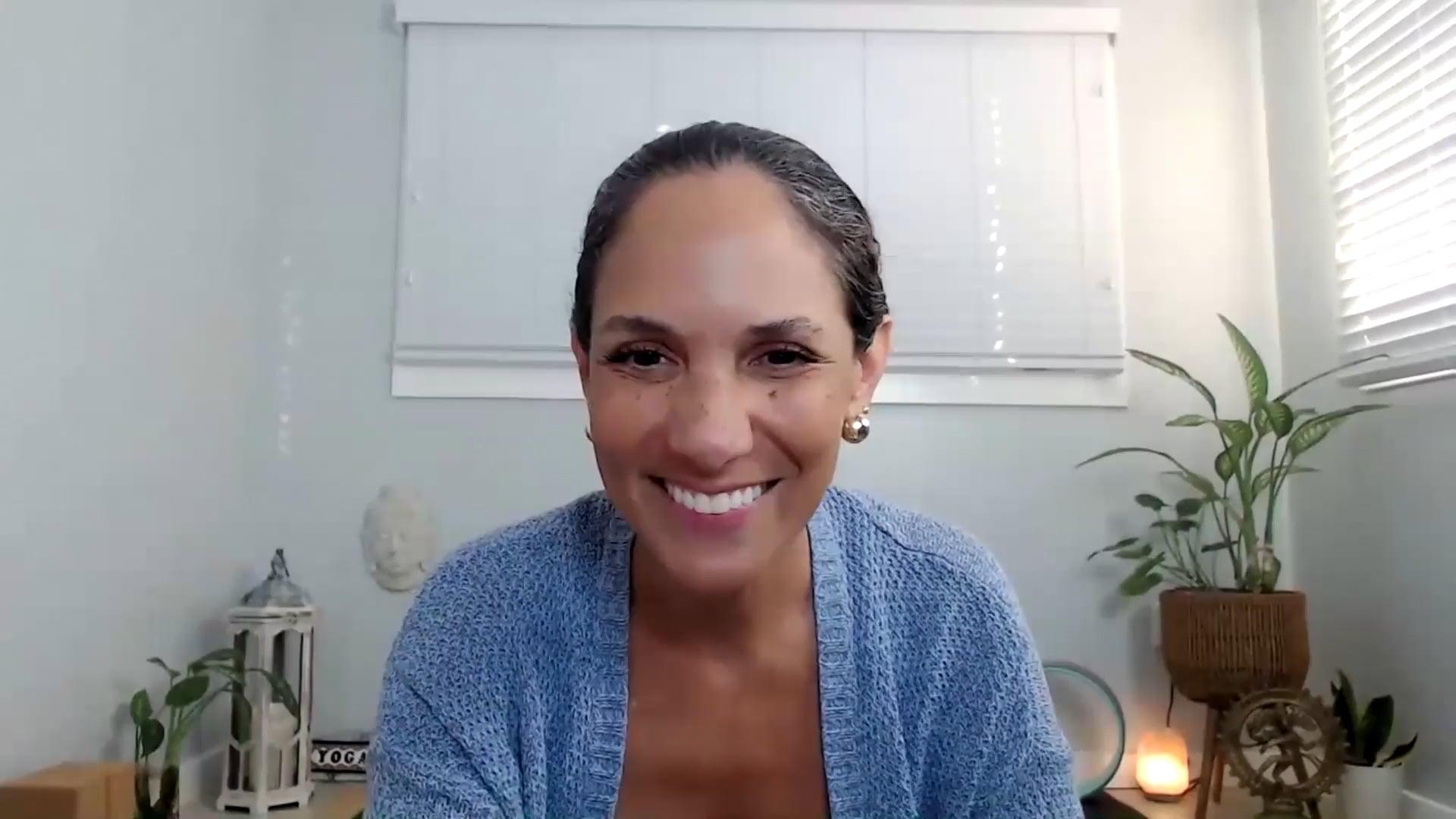 Ompractice teacher Yely Rivas sitting and smiling