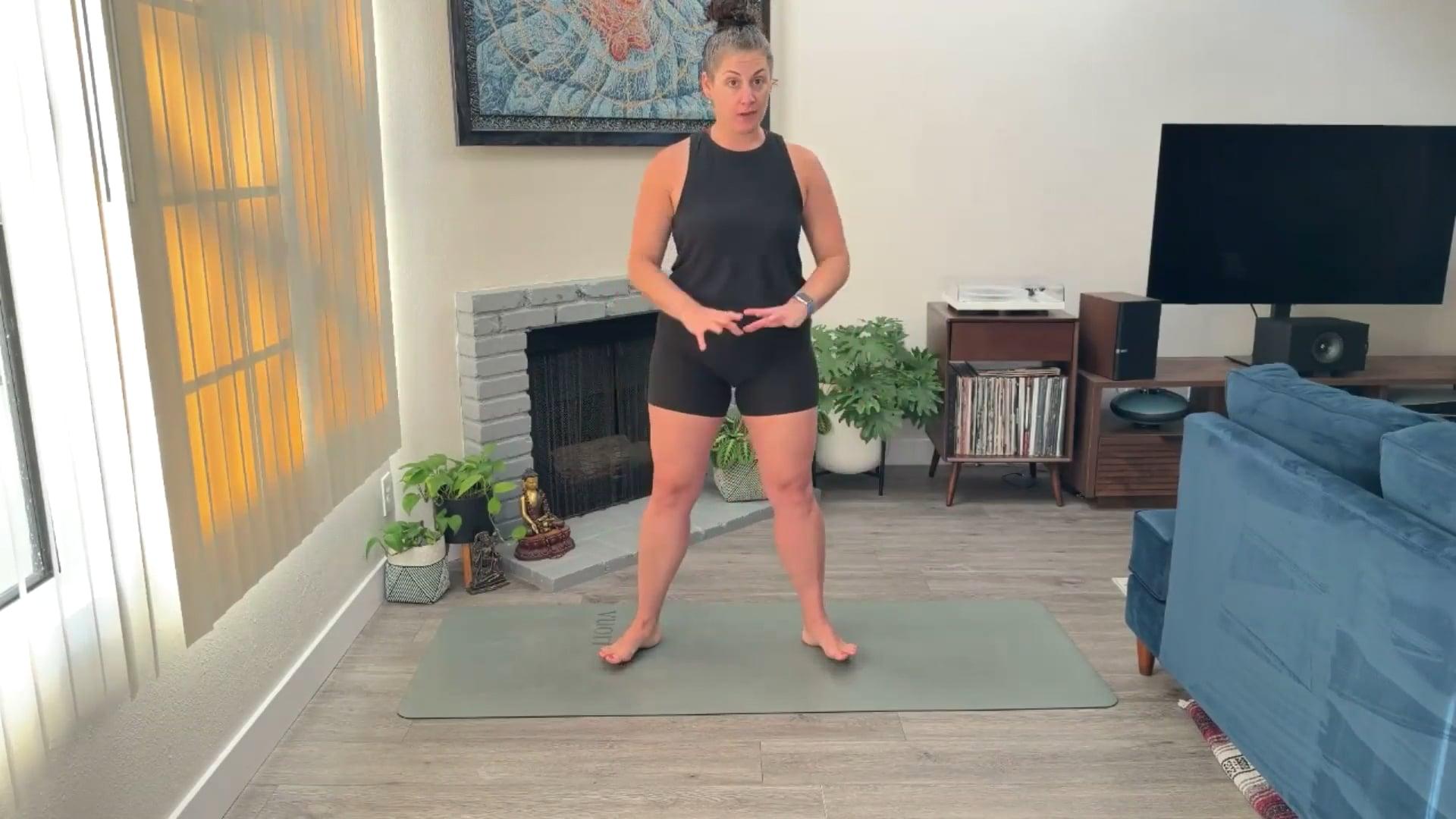 Ompractice teacher Niki Saccareccia demonstrating a standing pose