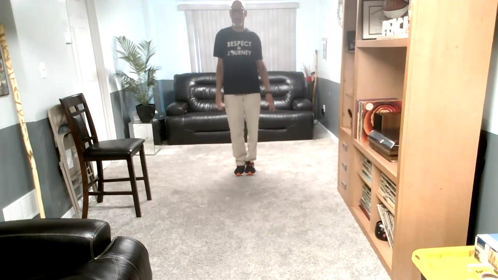 Ompractice teacher Sharif standing Tai Chi