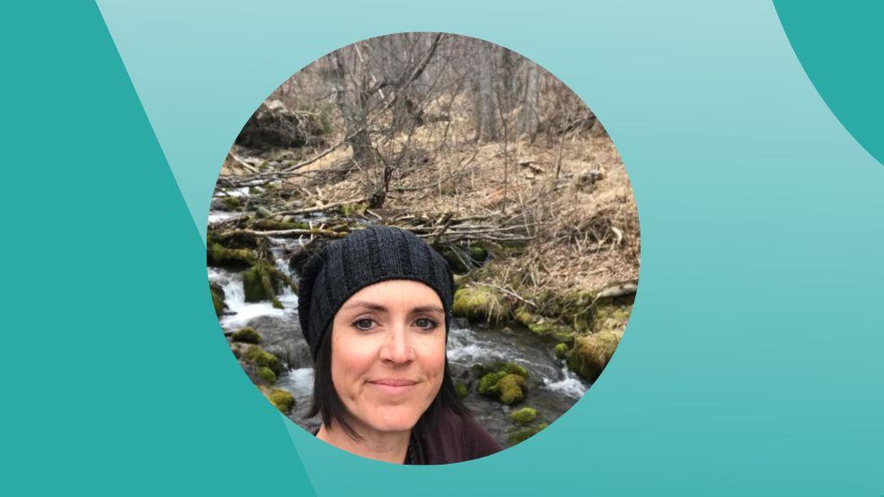 Ompractice teacher Katy Mills heashot with forest background