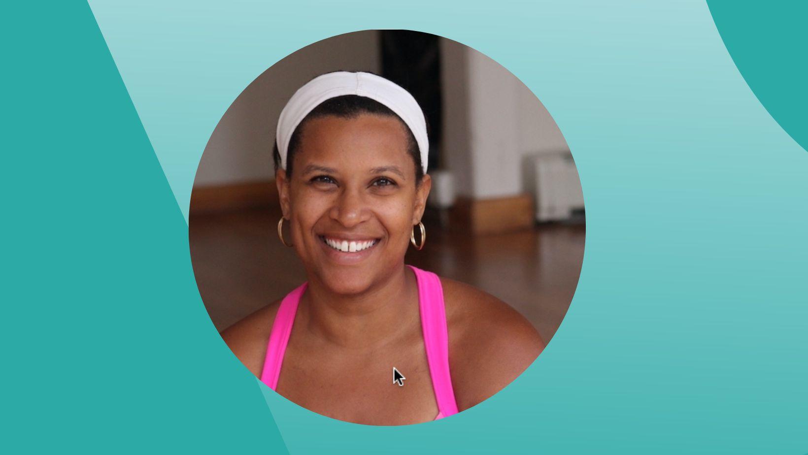 Ompractice teacher Devon smiling in a pink tank top