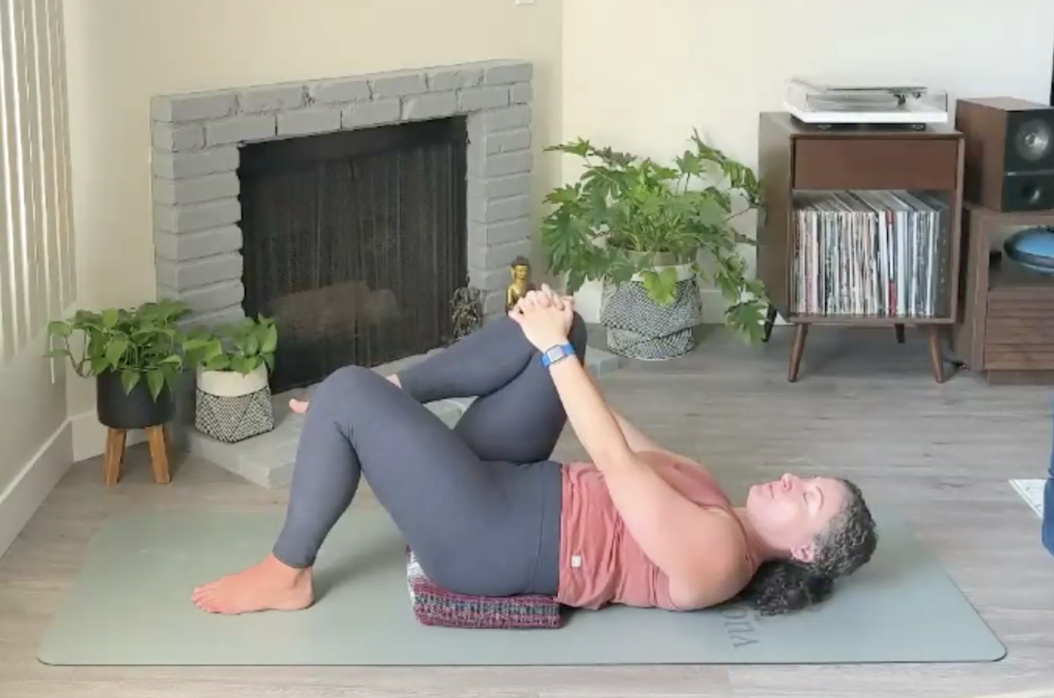 Ompractice Teacher Niki Saccareccia Lying on Back on a Mat
