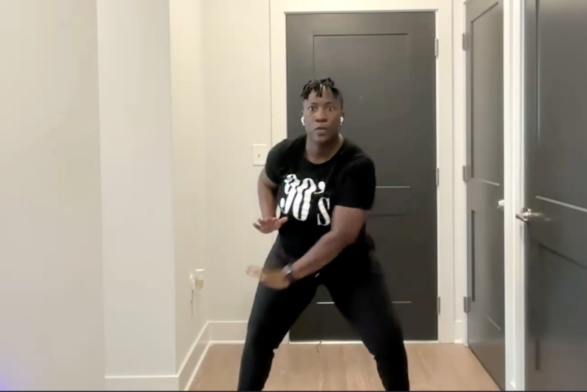 Ompractice Teacher Tasha Edwards doing a light squat